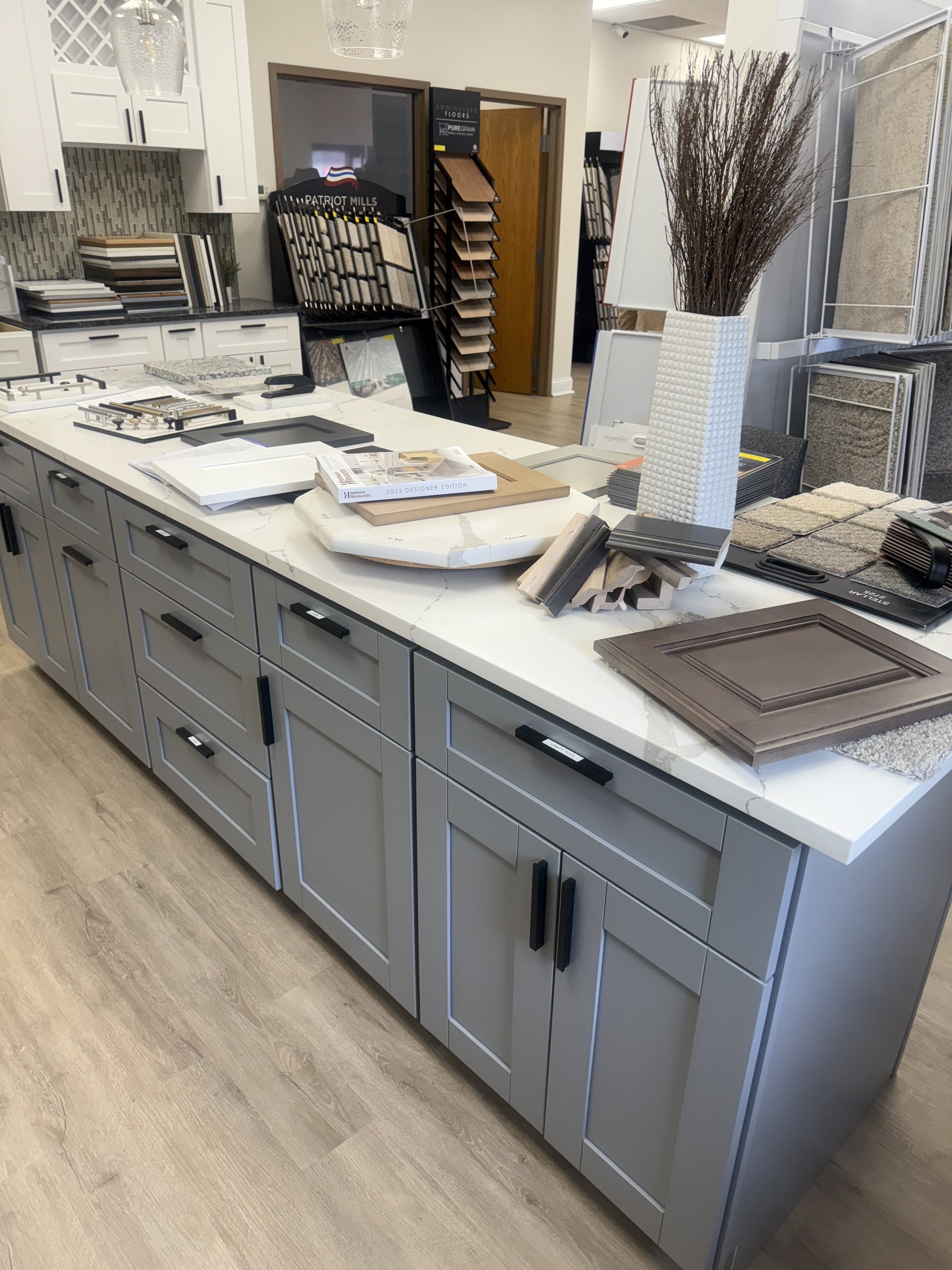 Illustrative design plate of a showroom island with door samples — not a named install